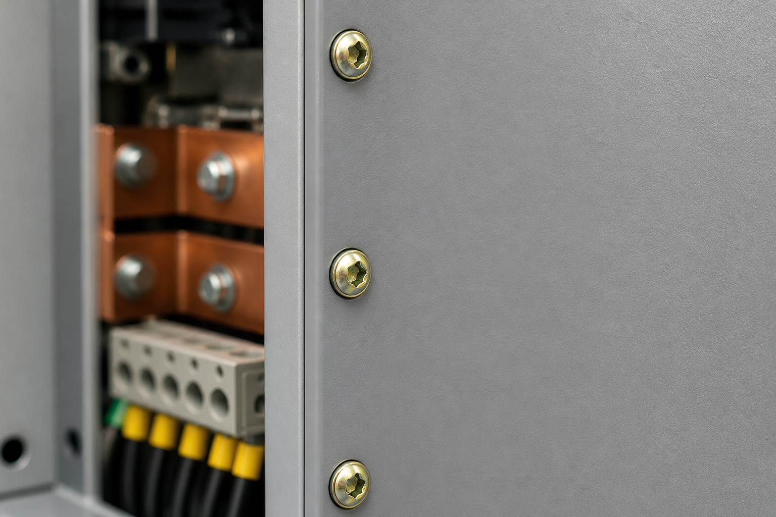 Inverter cabinet — panel screws sit above the busbar compartment; the recess stays serviceable after repeated removal.