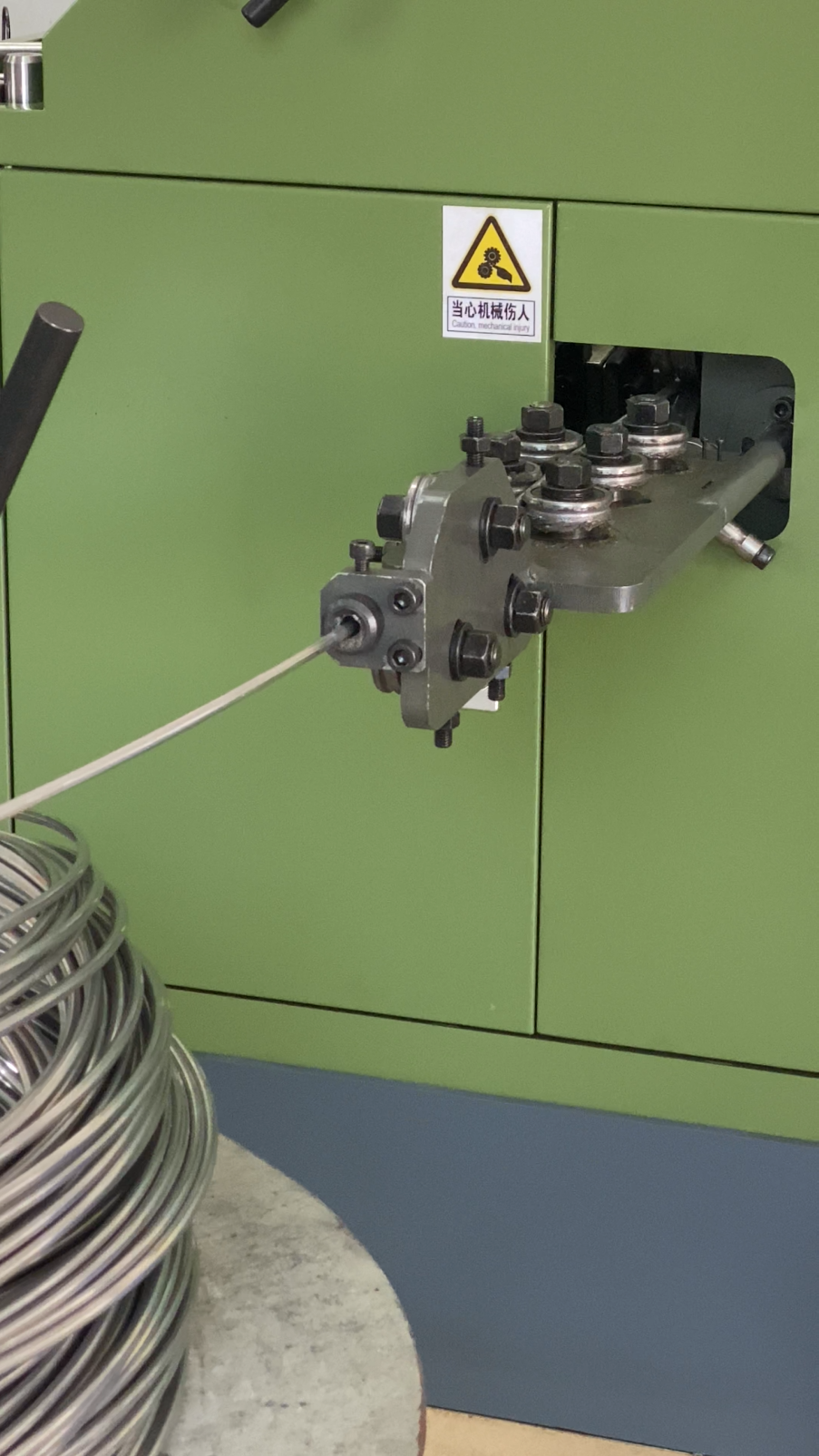 Heading machine forming the head of a screw at Shi Shi Tong