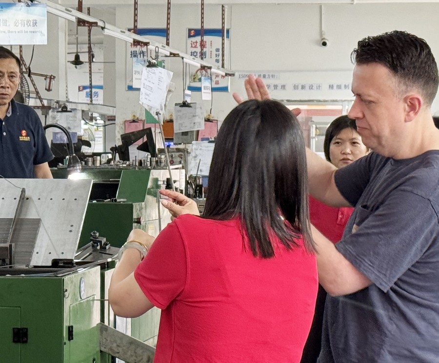 Customer reviewing first-article parts with our QC team