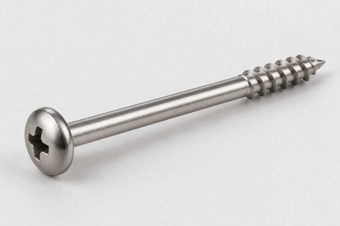 Stainless steel pan head self-tapping screw with a Phillips cross recess and a long plain shank above a short tapping thread