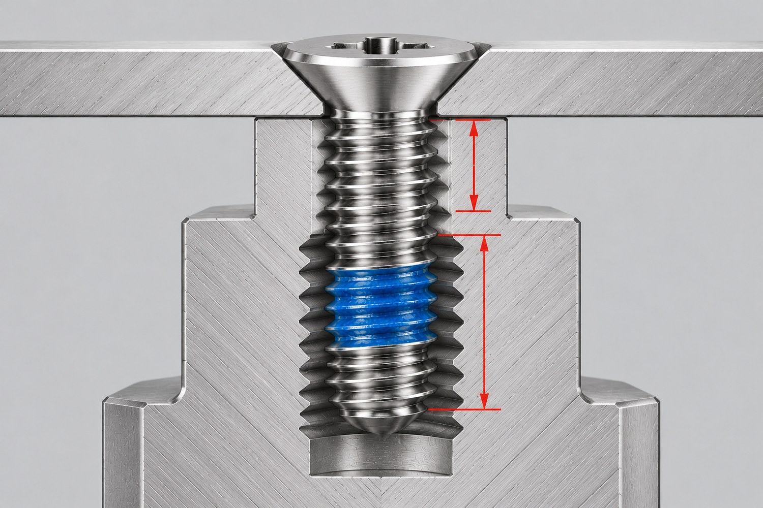 Section of a screw through a plate into a tapped boss showing engaged length and patch band position