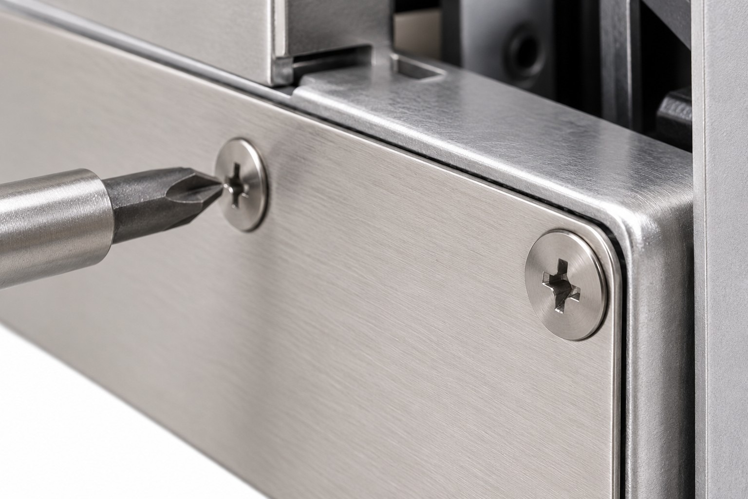 Ultra-thin head Phillips screws in a restricted clearance assembly